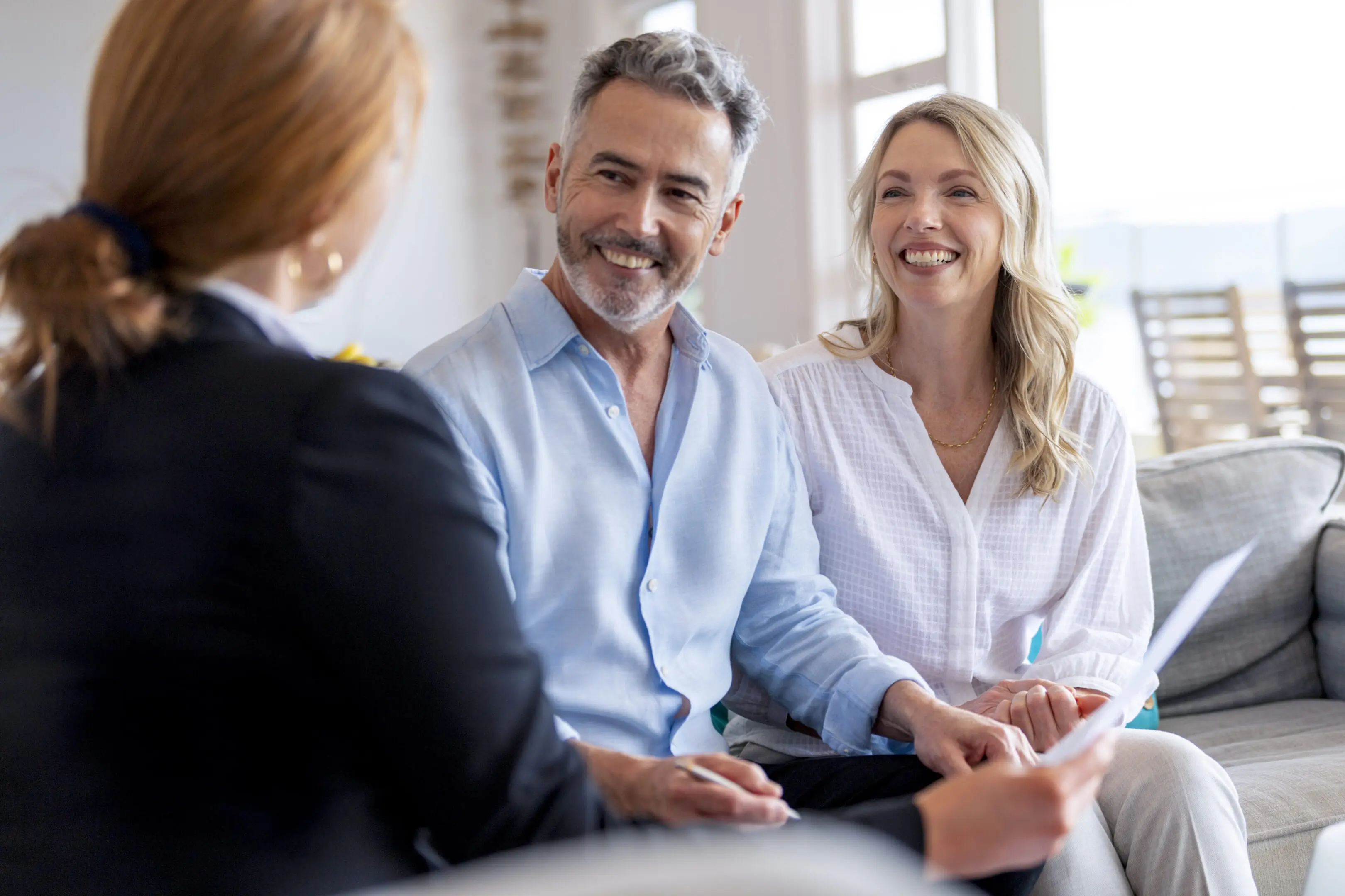 Couple smiling during a professional consultation.