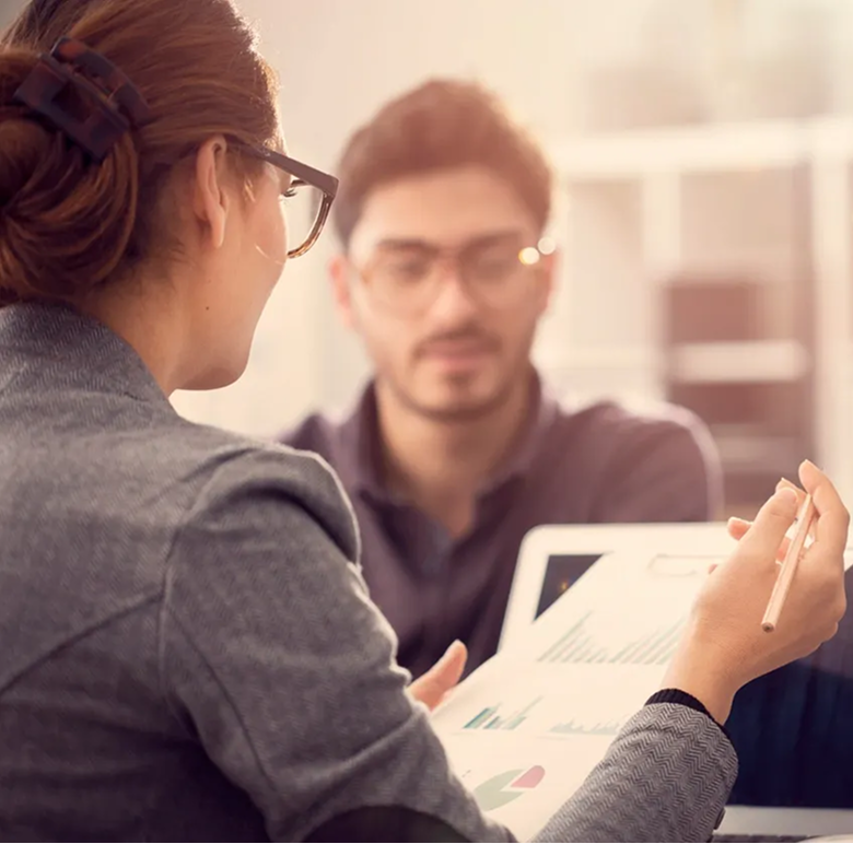 Business meeting with digital tablet discussion.