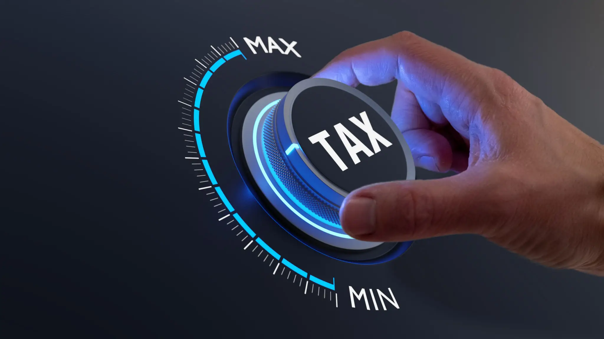 Hand adjusting tax level control dial.